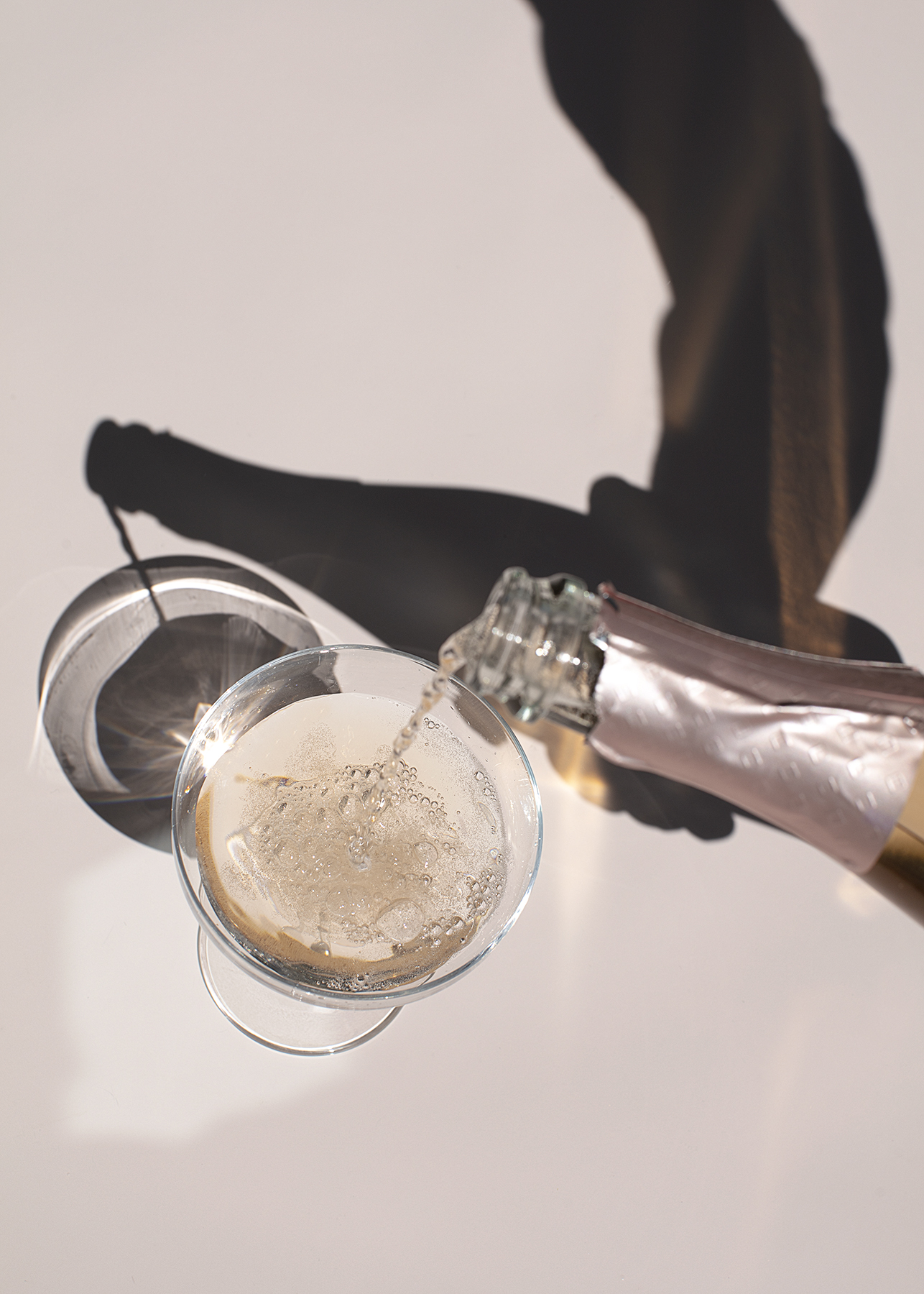 Stock image of champagne being poured into a glass to showcase celebration