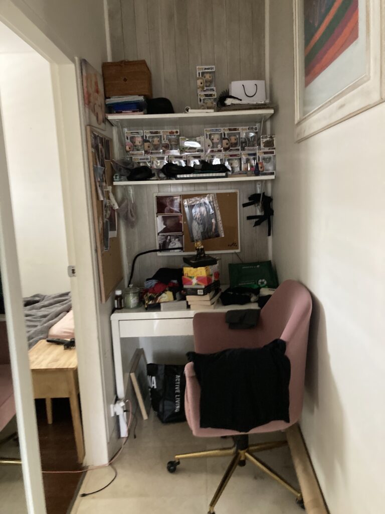 Photo of wall added to the first floor hallway to separate the two units. The owner added a desk to this space.