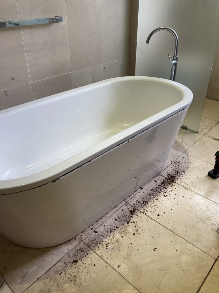 Photo of the old bathtub that we discovered had a lot of rust so we couldn’t reuse it for the new bathroom