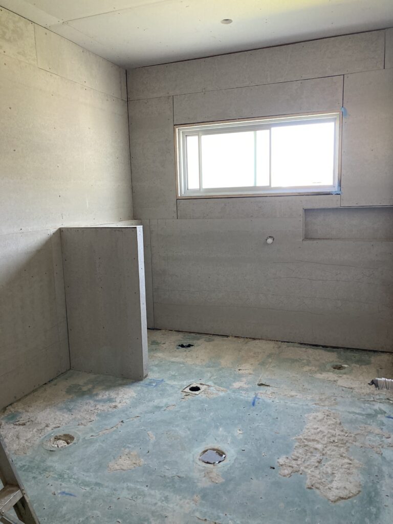 Photo of the bathroom after the villa boards and nib wall were installed