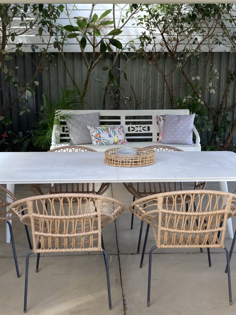 Second outdoor dining area under the carport