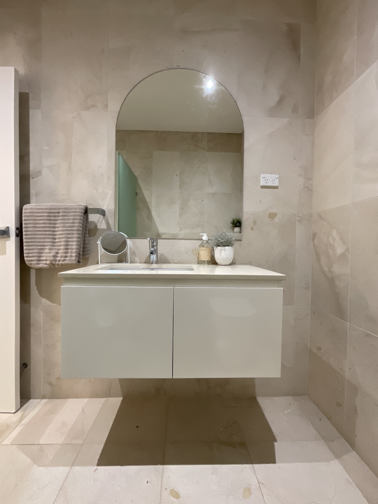 Vanity in the ground floor bathroom. We replaced the mirror with a large arch shaped one.