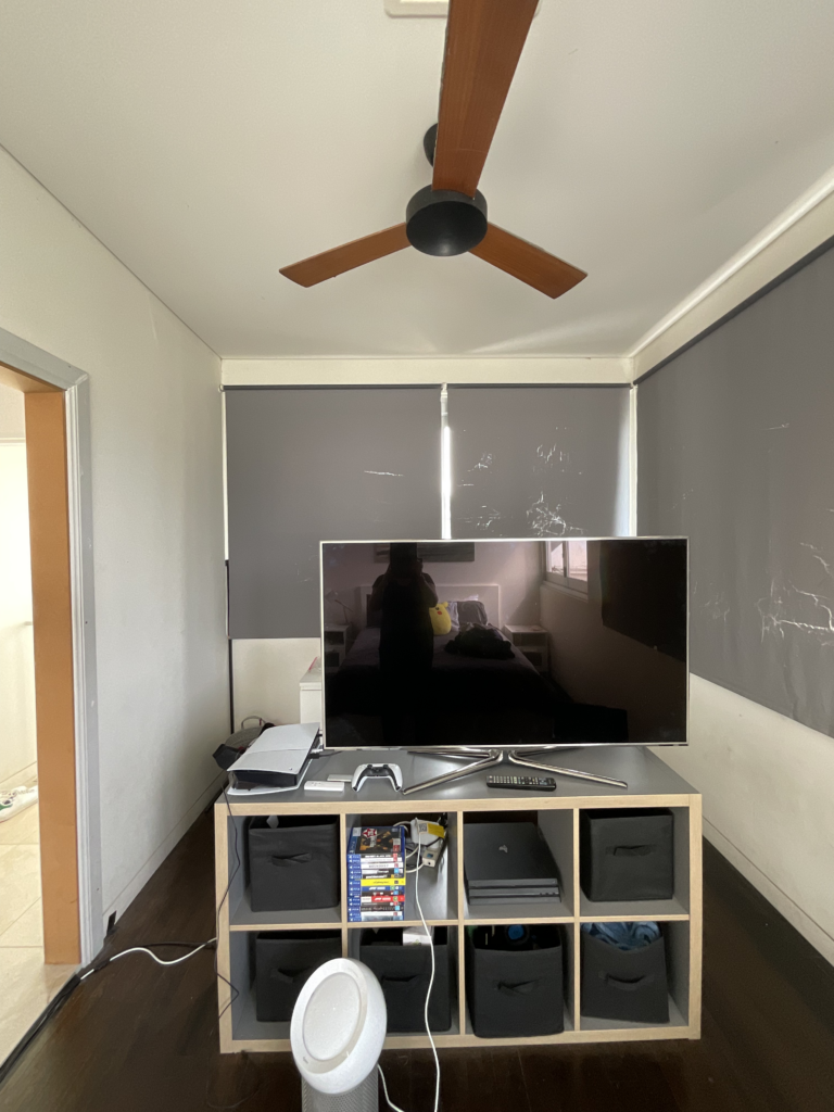 Image of the before home office renovation looking towards the north facing windows with paper blockout blinds. 