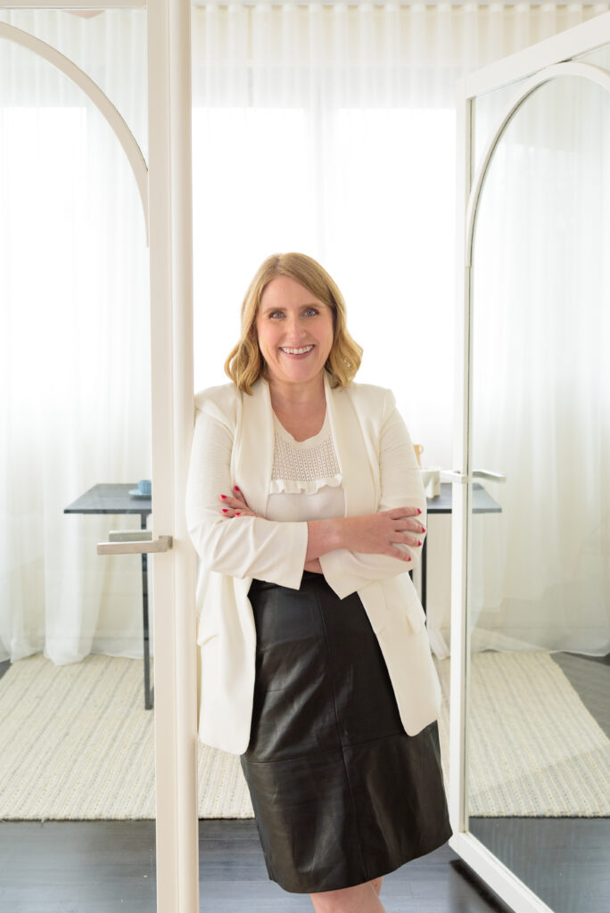 Kristen in front of the new study doors in the Sandringham pre-sale renovation