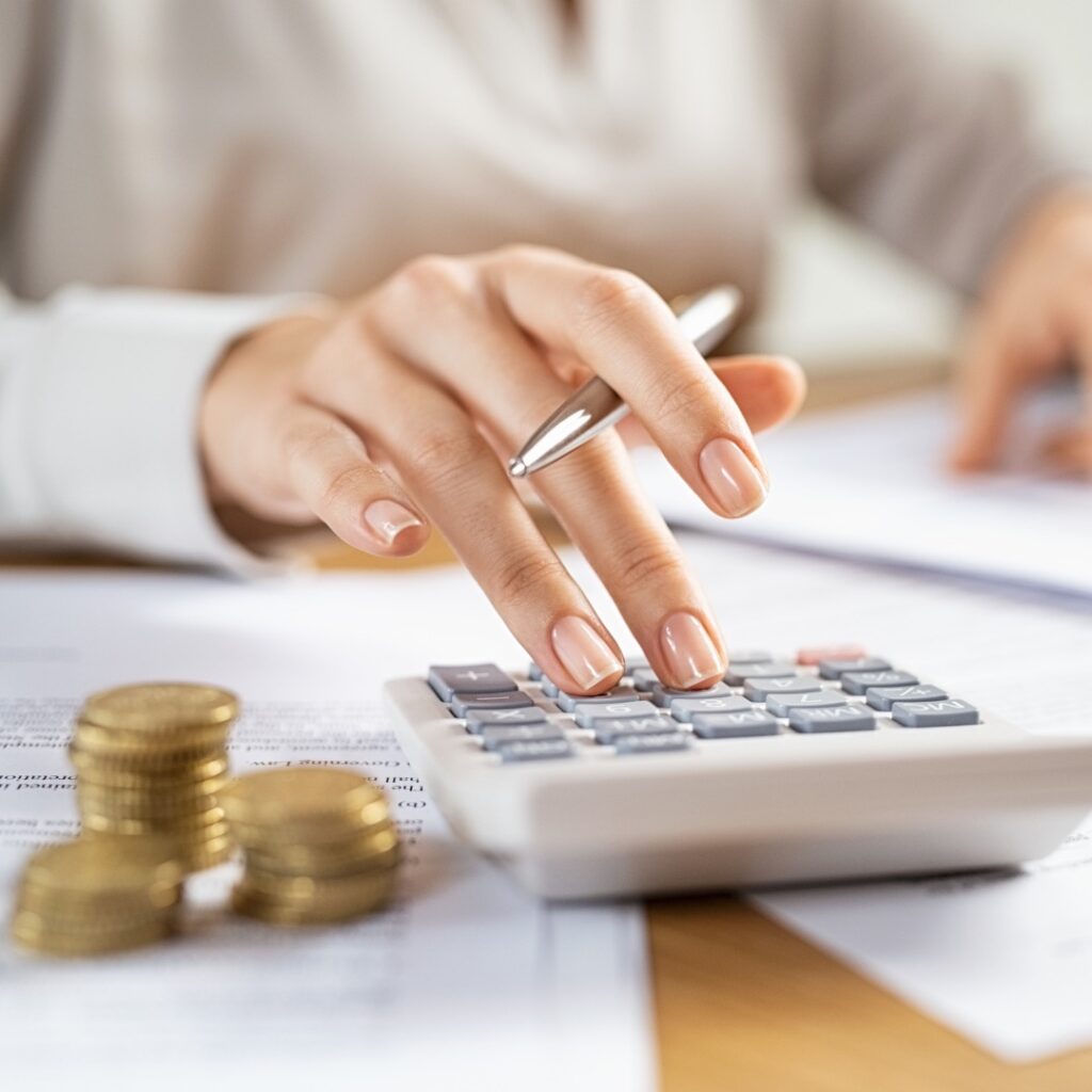 Stock image of a person using a calculator to illustrate that this is a home value calculator for Sydney homeowners