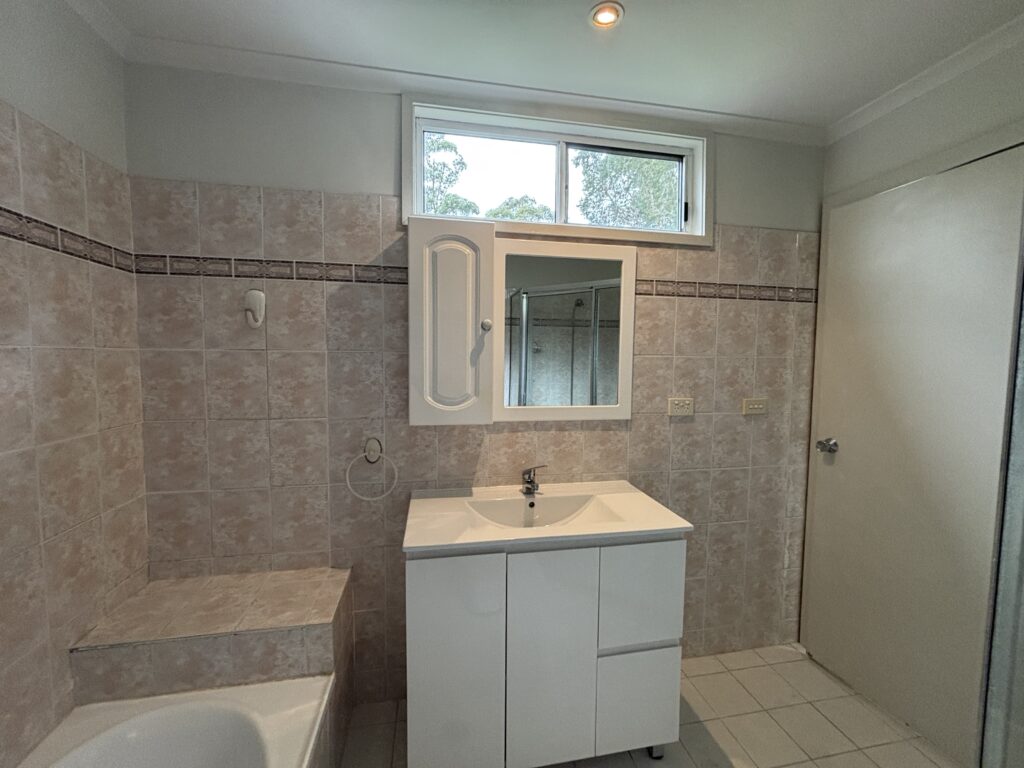 Before photo of the bathroom where we are adding value to a semi