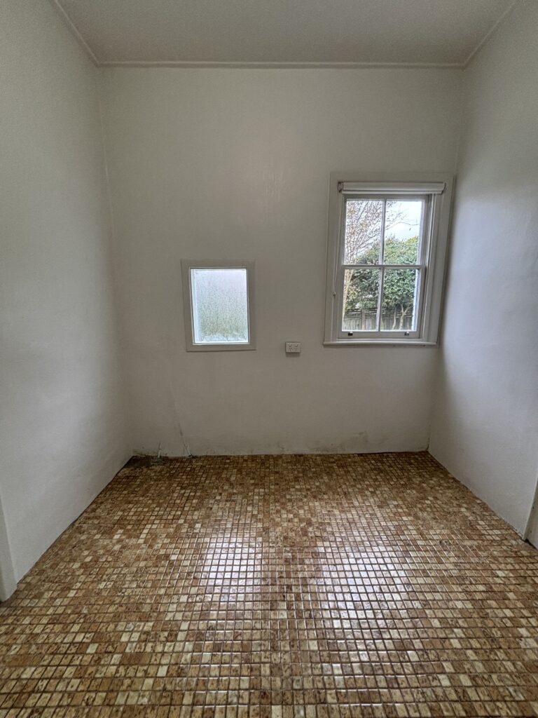 Before photo of the Sydney semi renovation showing a large under utilised space where we will be adding a second bathroom