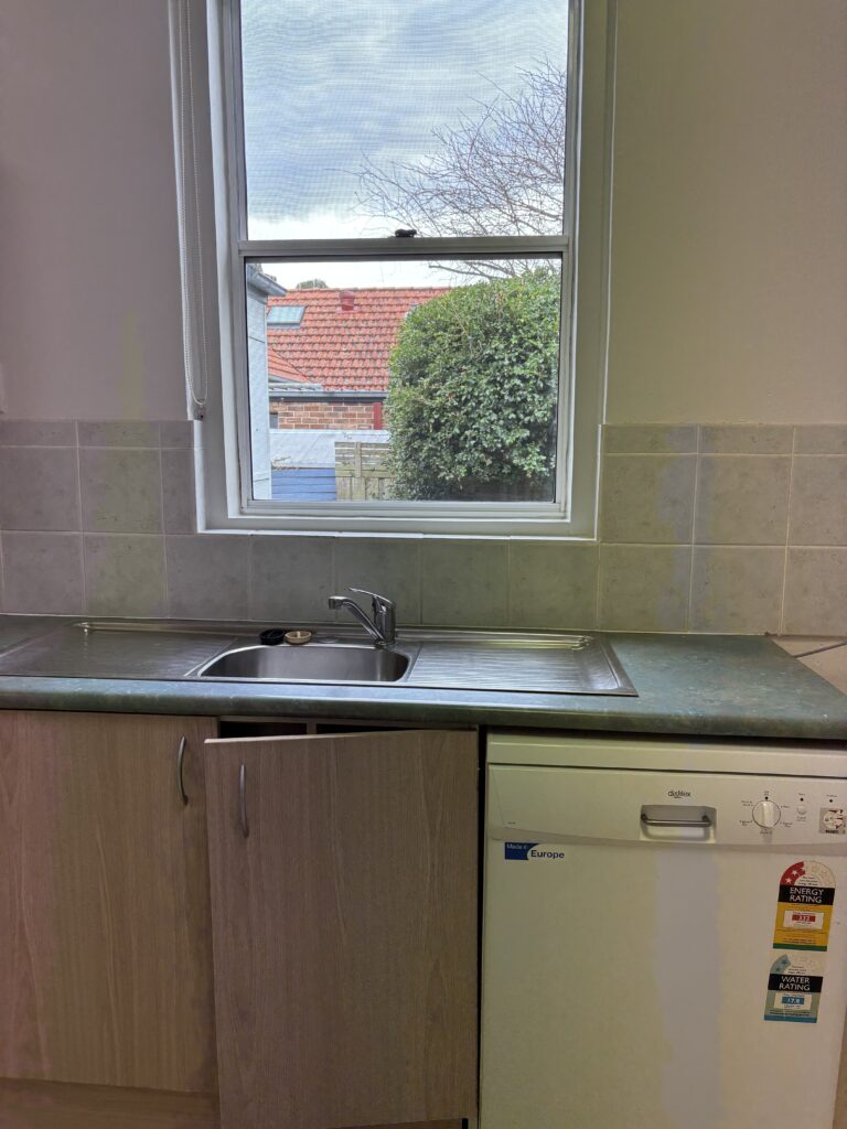 Before image of left side of the kitchen with the sink, before I added $1 million value to this home