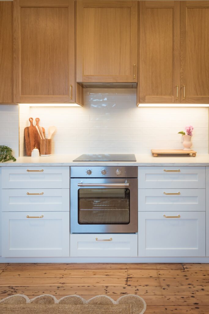 After image of one side of the kitchen featuring Ikea cabinets and a TileCloud splashback, which contributed to adding $1 million in value to this Sydney property