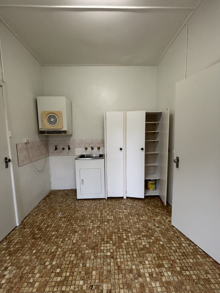 Before image of the laundry room