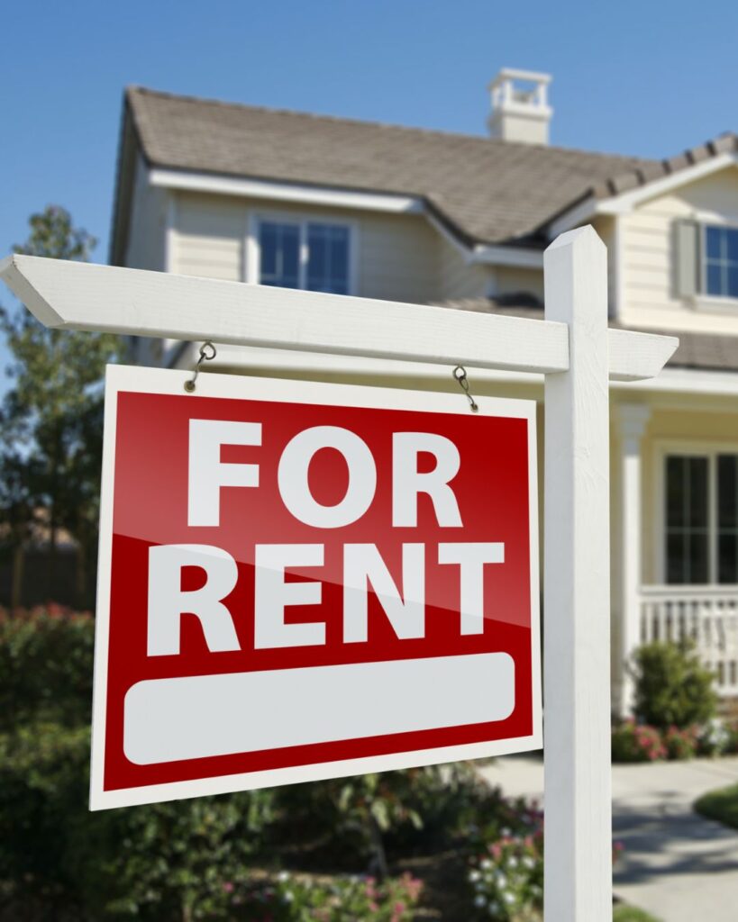 Stock image of a house with a For Rent sign to show that this article is about properties that are thinking a about renovating to rent